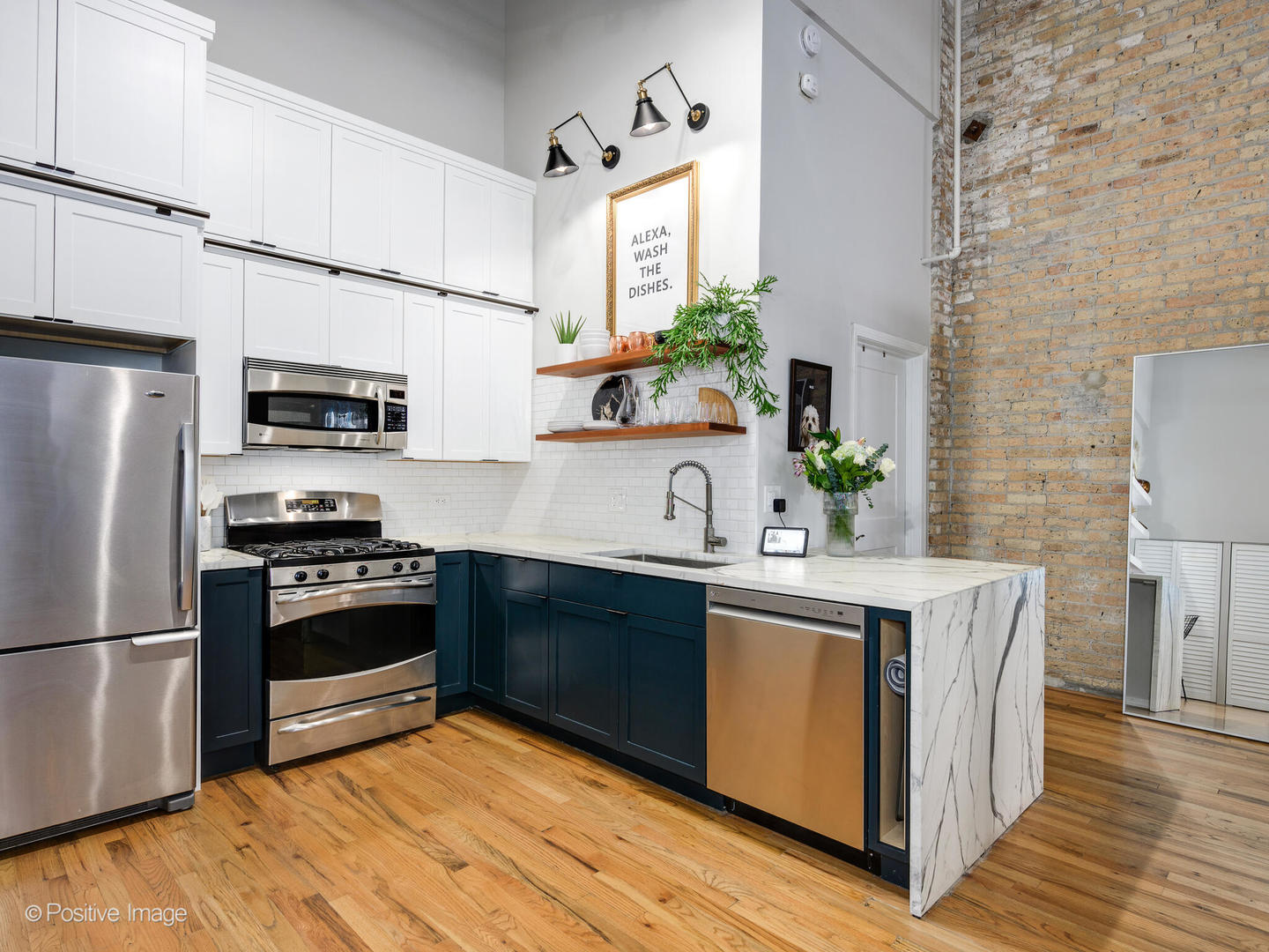 203 South Sangamon Street, Unit 216 Chicago, IL 60607 - Photo 12 of 22 a kitchen with stainless steel appliances a stove a sink and a refrigerator