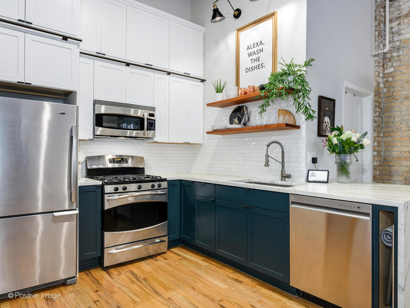 203 South Sangamon Street, Unit 216 Chicago, IL 60607 - Photo 13 of 22 a kitchen with stainless steel appliances a stove a sink and a refrigerator