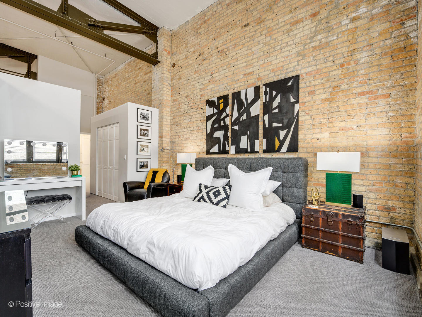 203 South Sangamon Street, Unit 216 Chicago, IL 60607 - Photo 14 of 22 a bedroom with bed and walk in closet