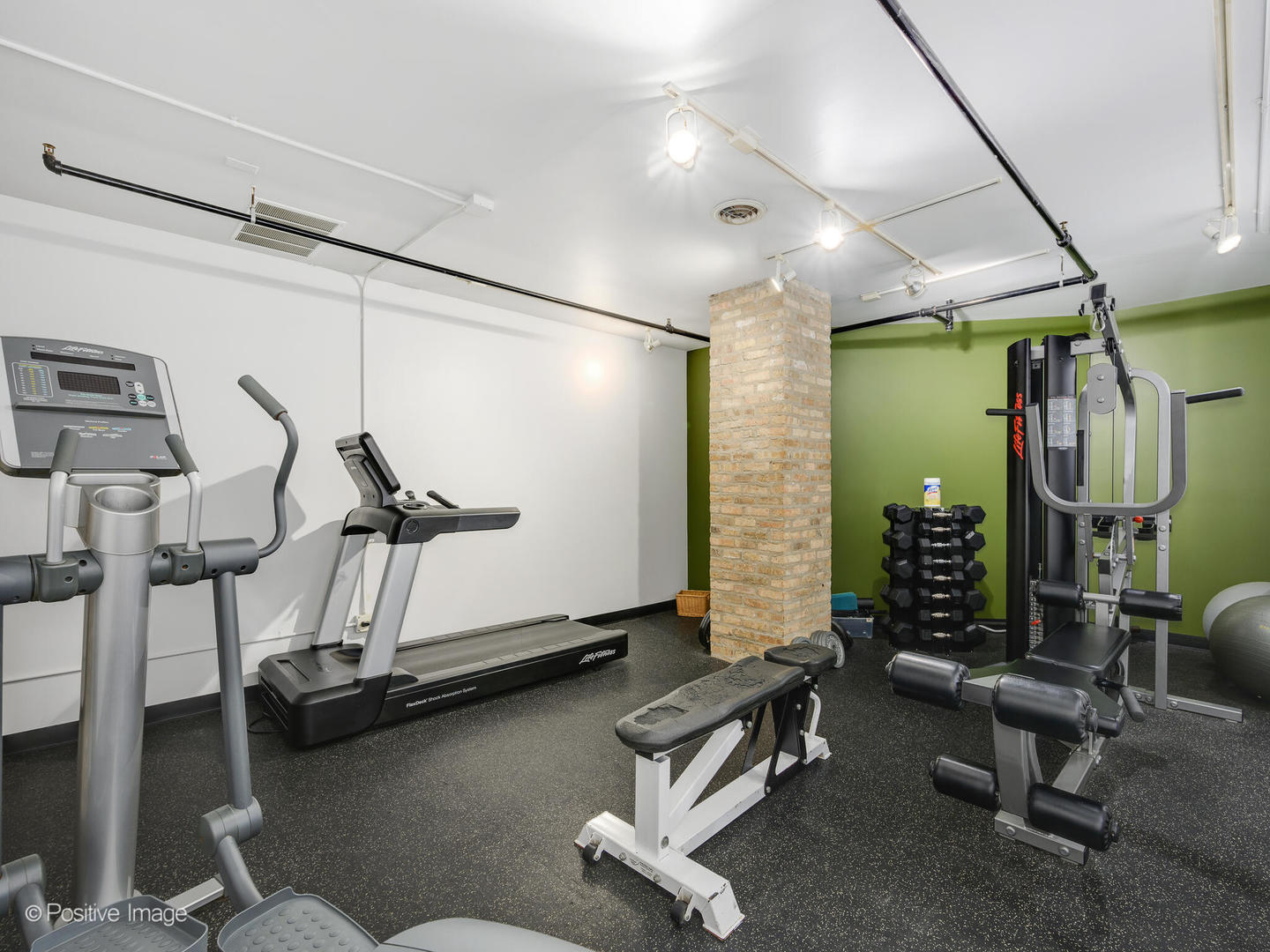 203 South Sangamon Street, Unit 216 Chicago, IL 60607 - Photo 18 of 22 a room with gym equipment