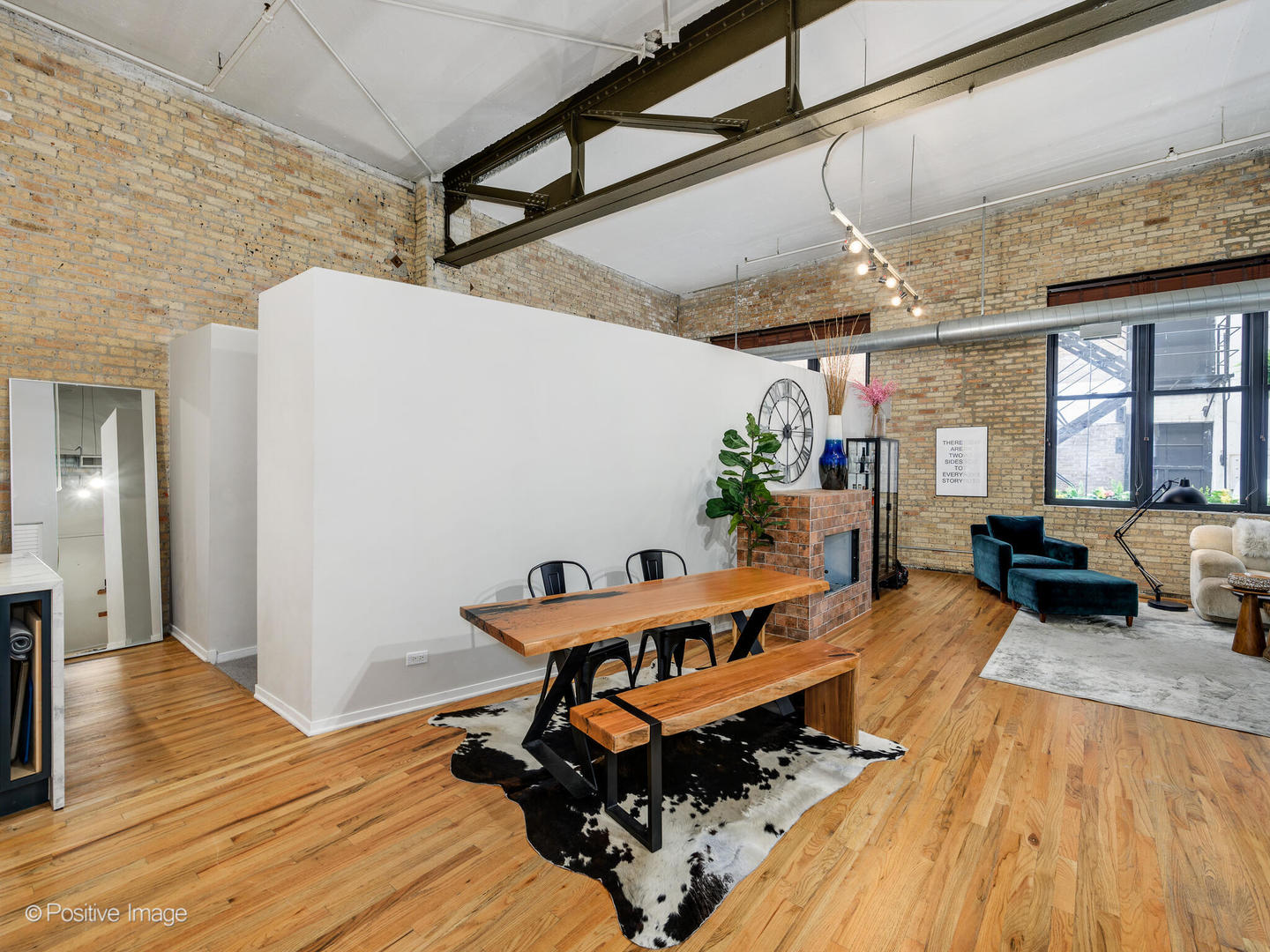 203 South Sangamon Street, Unit 216 Chicago, IL 60607 - Photo 8 of 22 a room with furniture and wooden floor