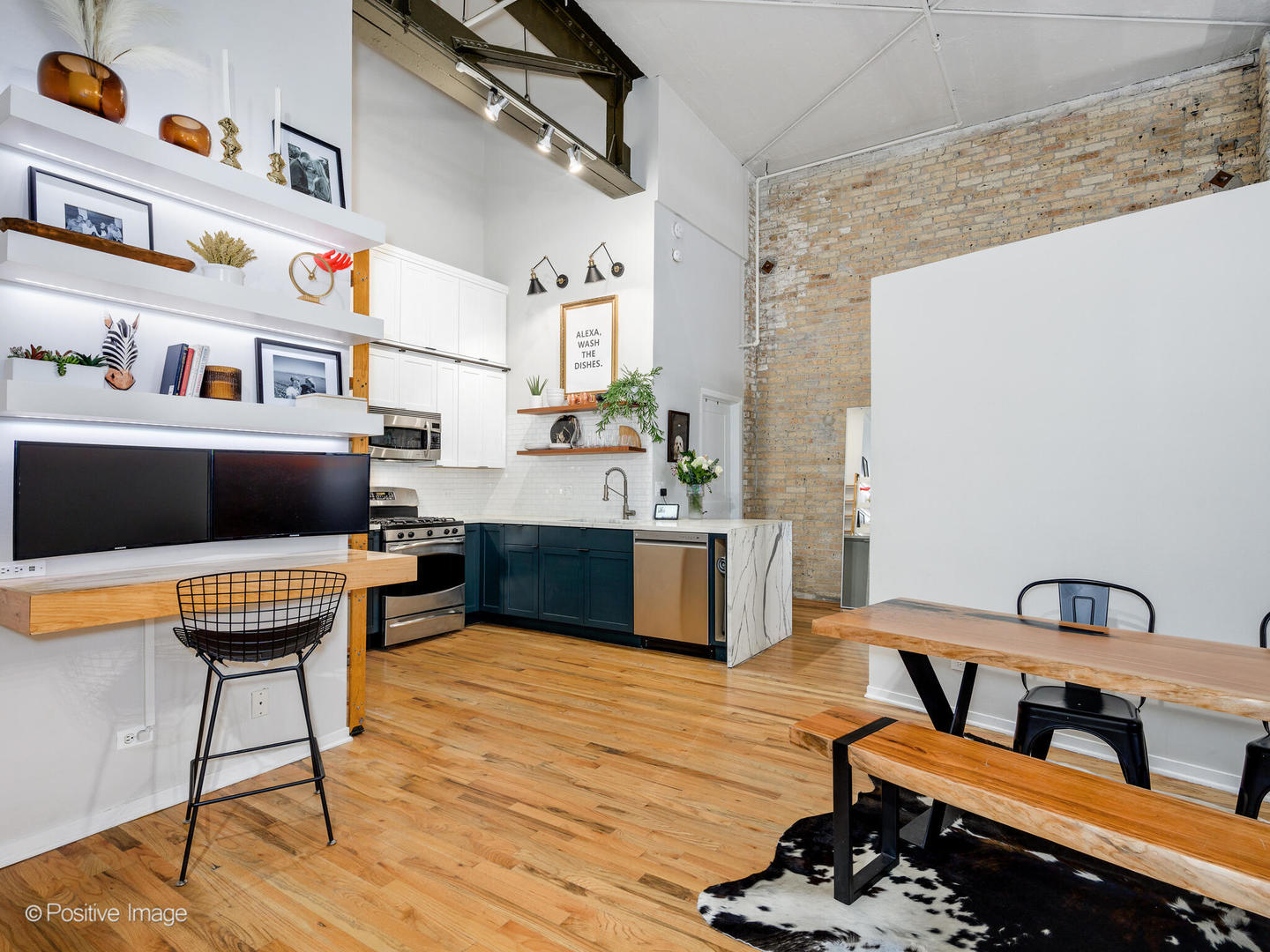 203 South Sangamon Street, Unit 216 Chicago, IL 60607 - Photo 10 of 22 a living room with furniture and a kitchen view