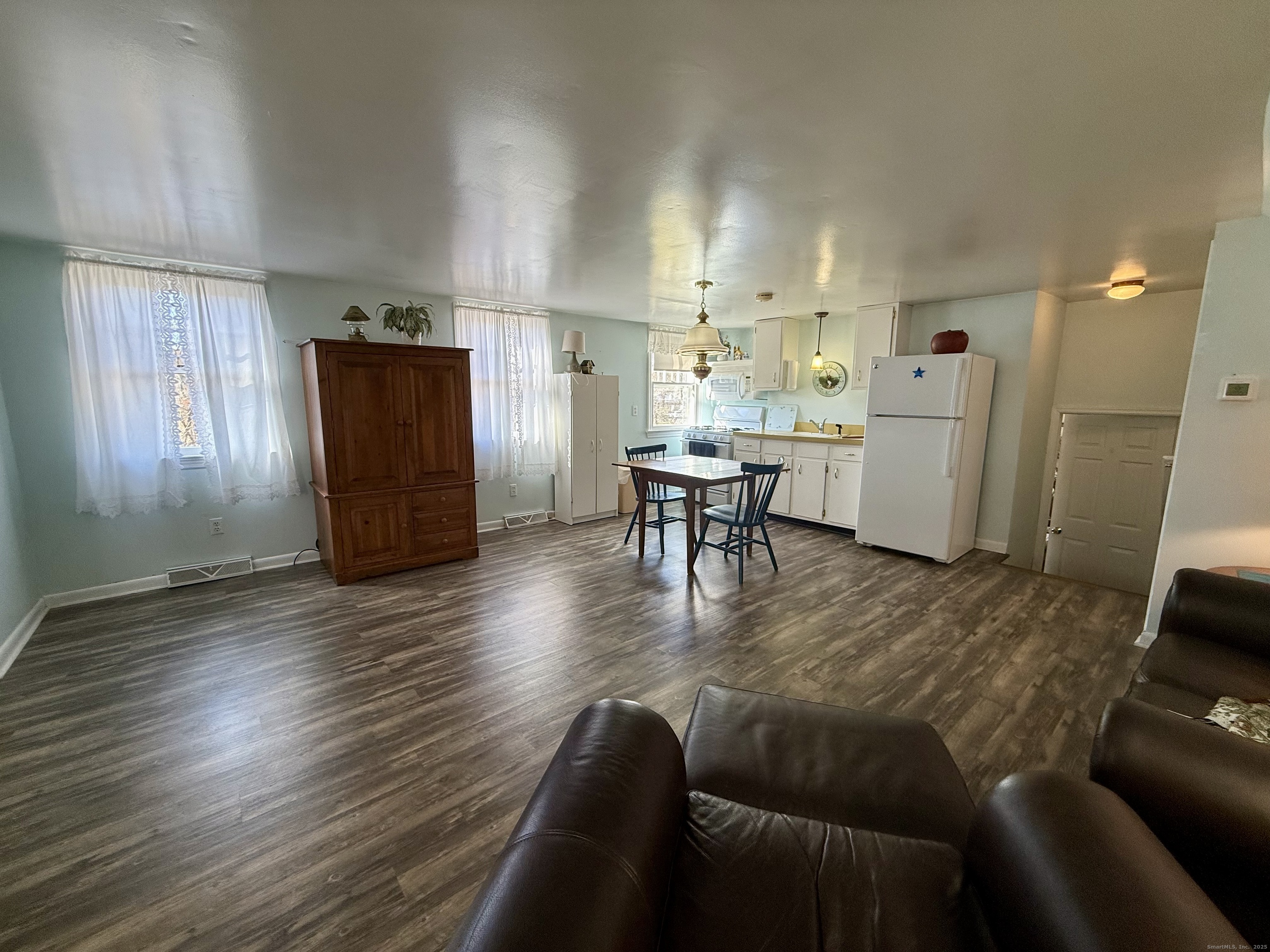 176 Pocono Road, Unit 2 Brookfield, CT 06804 - Photo 4 of 12 a living room with furniture and a wooden floor