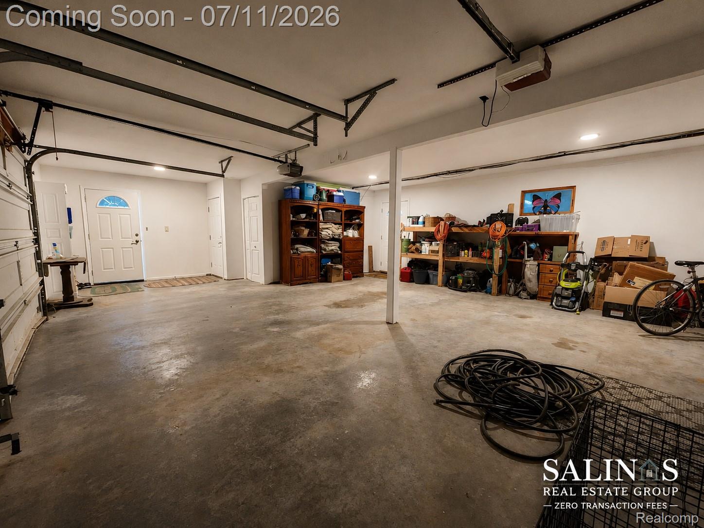 2120 Montague Road Davison, MI 48423 - Photo 35 of 37 Spacious garage with concrete flooring, overhead garage door track system, and recessed ceiling lighting