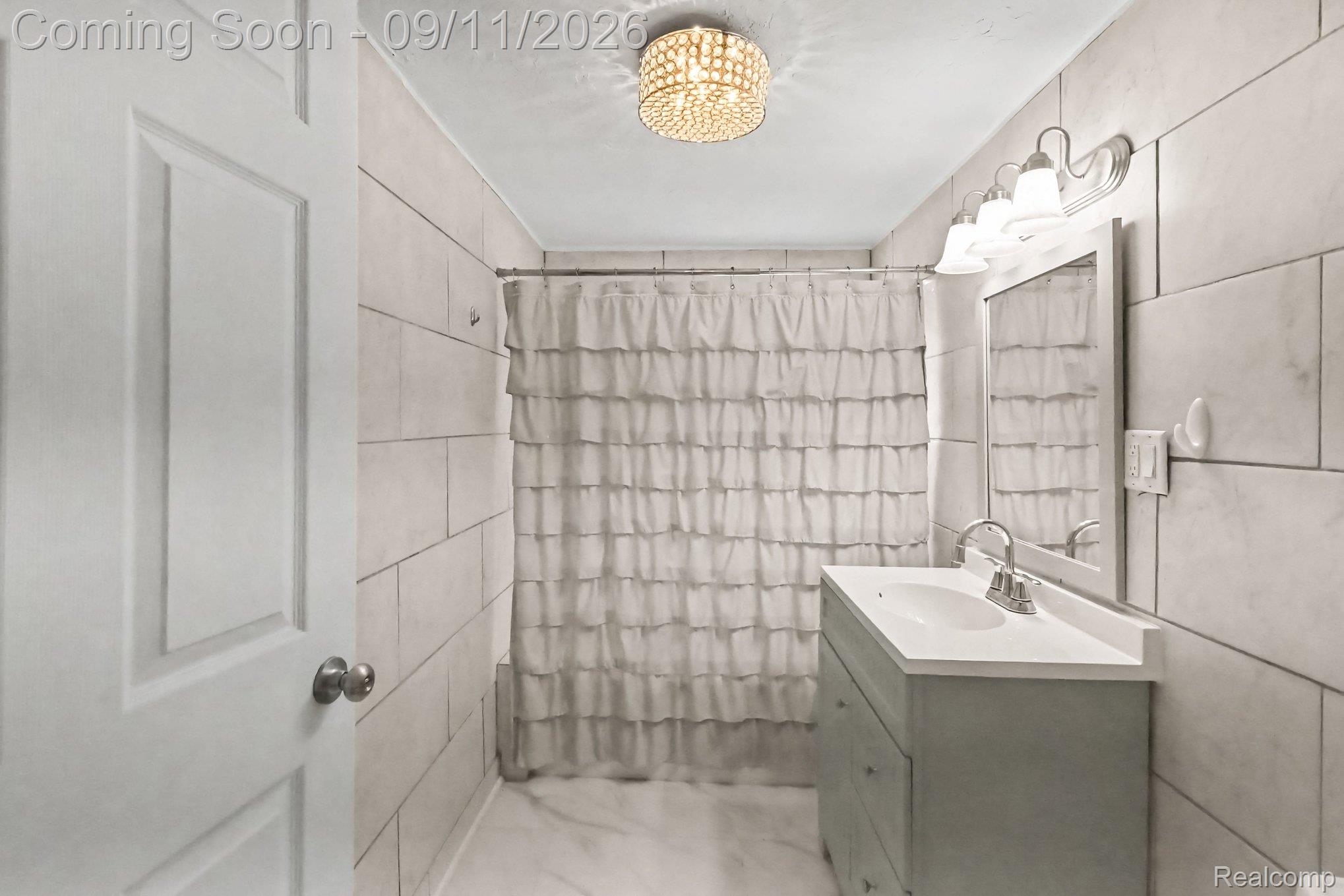 409 Fleming Street Howell, MI 48843 - Photo 13 of 25 Modern vanity with integrated sink