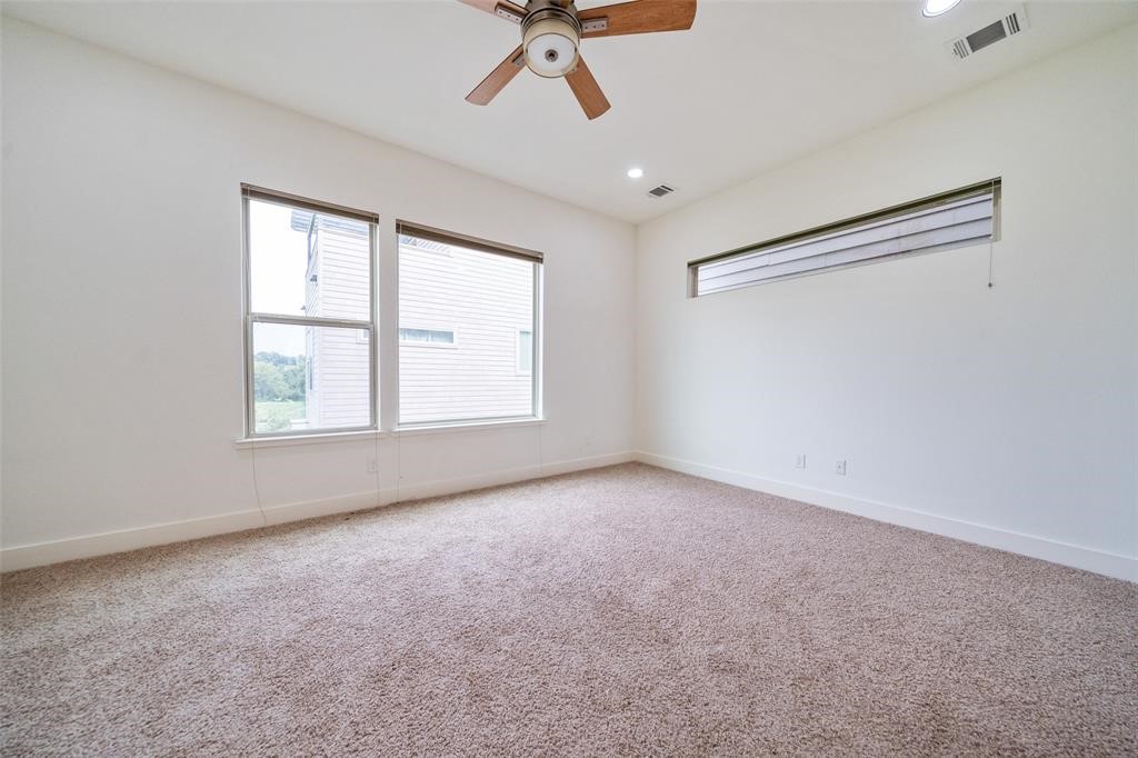 194 Harvard Street Houston, TX 77007 - Photo 21 of 43 a view of an empty room with a window