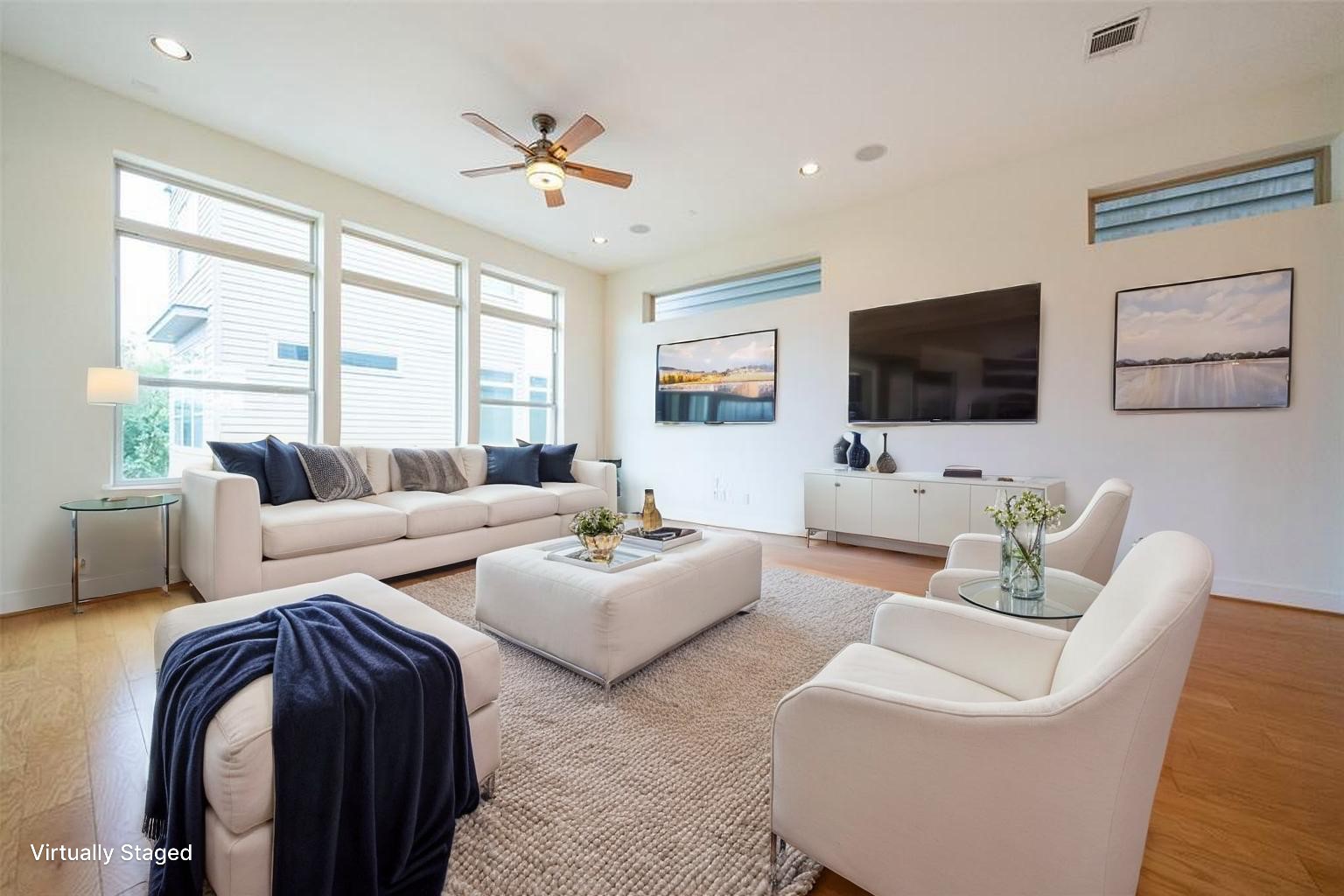 194 Harvard Street Houston, TX 77007 - Photo 7 of 43 a living room with furniture a flat screen tv and a large window