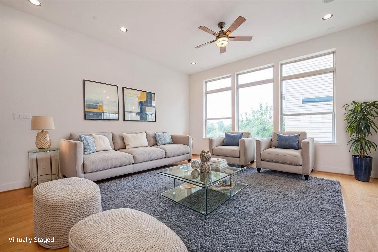 194 Harvard Street Houston, TX 77007 - Photo 9 of 43 a living room with furniture ceiling fan and a large window