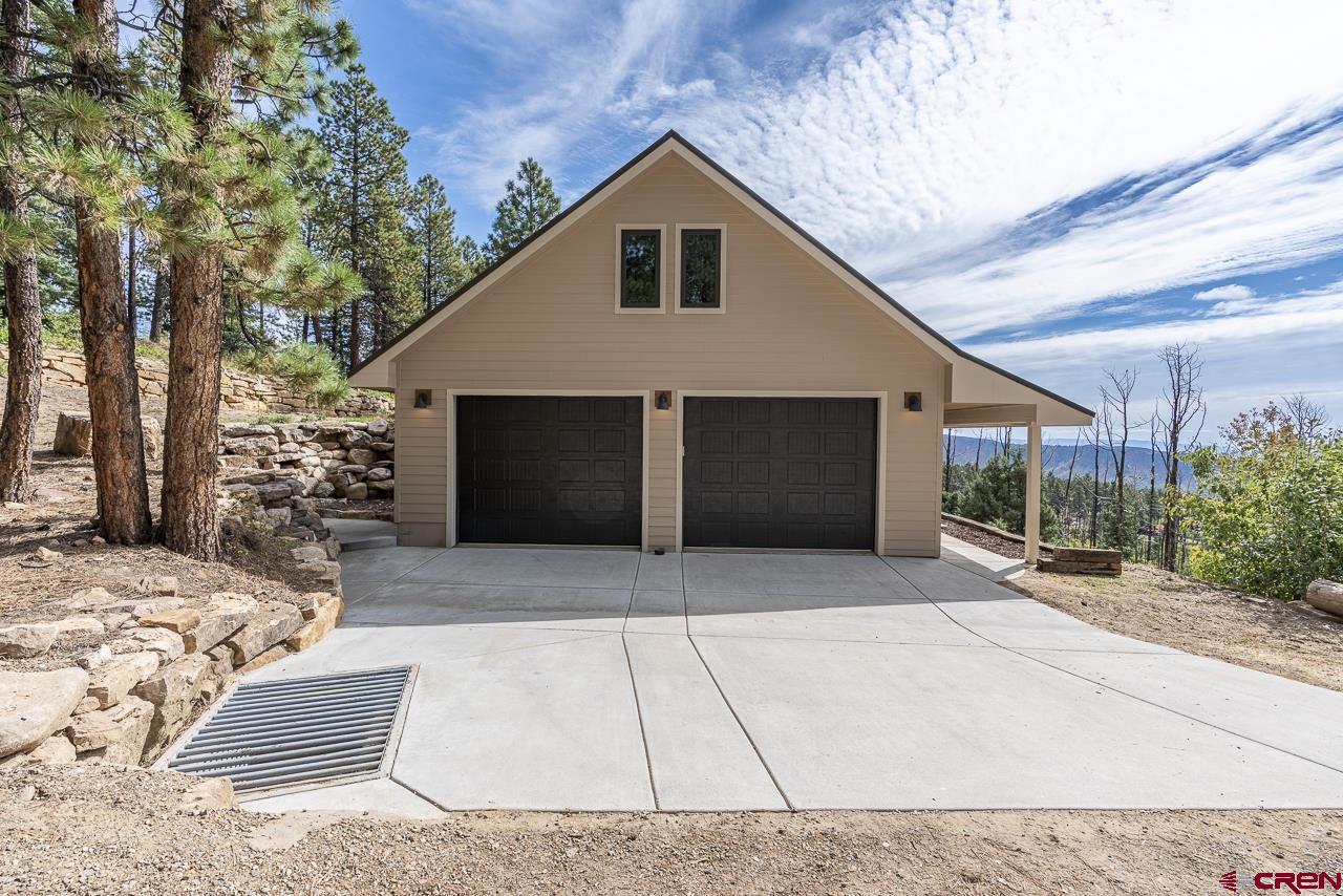 1550 Silver Mesa Driveway Durango, CO 81301 - Photo 2 of 34 a front view of a house with a yard