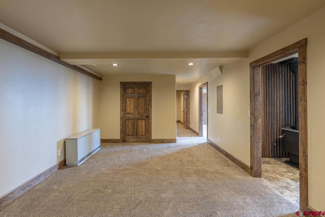 1550 Silver Mesa Driveway Durango, CO 81301 - Photo 24 of 34 an empty room with closet and wooden door
