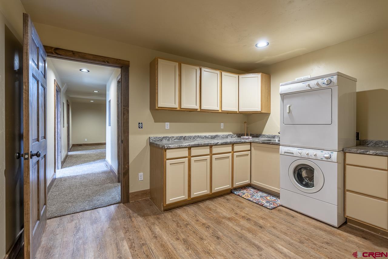 1550 Silver Mesa Driveway Durango, CO 81301 - Photo 28 of 34 a view of a kitchen with wooden floor and cabinets
