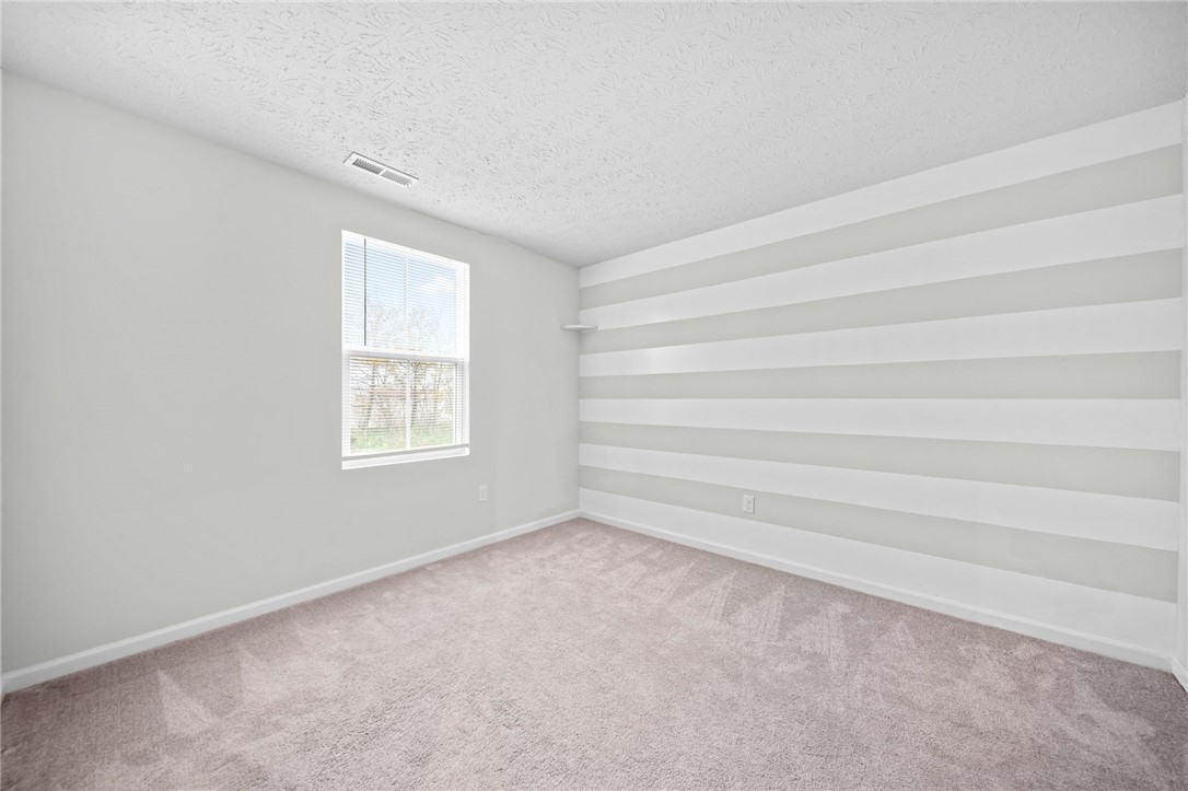226 Golden Gate Avenue Springfield, OH 45506 - Photo 14 of 20 This bright bedroom offers a peaceful retreat with ample natural light.