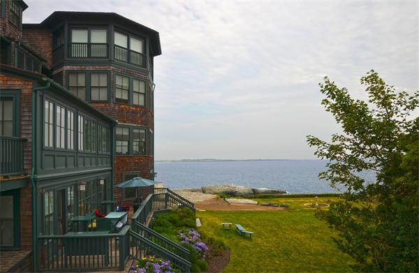 575 Tuckerman Avenue, Unit P Middletown, RI 02842 - Photo 2 of 30 a view of a house with a balcony