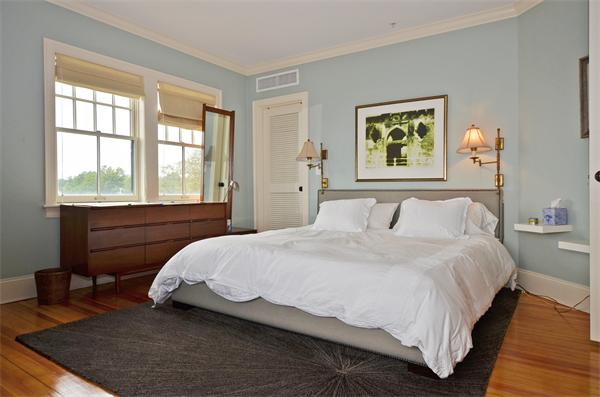 575 Tuckerman Avenue, Unit P Middletown, RI 02842 - Photo 24 of 30 a bedroom with a bed and a window