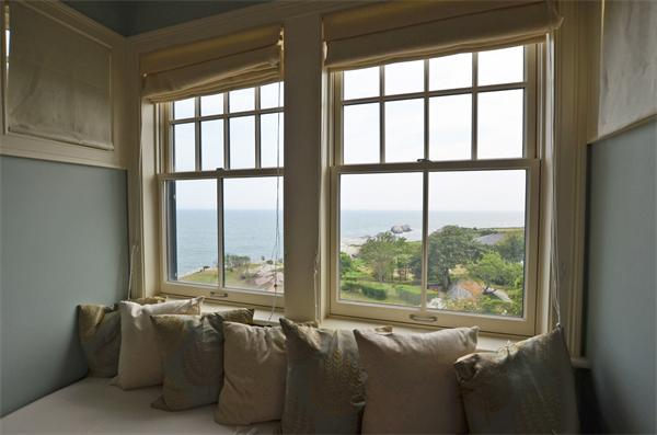 575 Tuckerman Avenue, Unit P Middletown, RI 02842 - Photo 25 of 30 a living room with furniture and a window