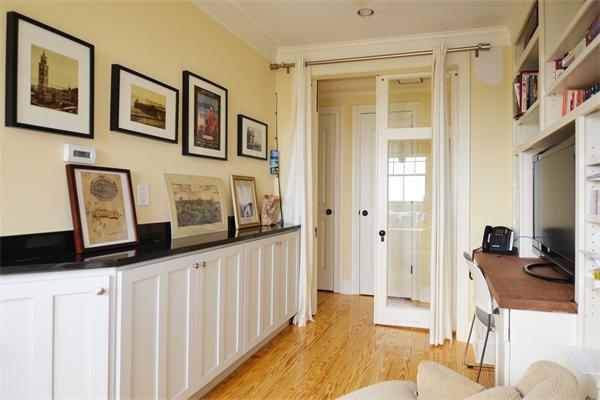 575 Tuckerman Avenue, Unit P Middletown, RI 02842 - Photo 26 of 30 a hallway with a large window and a kitchen view