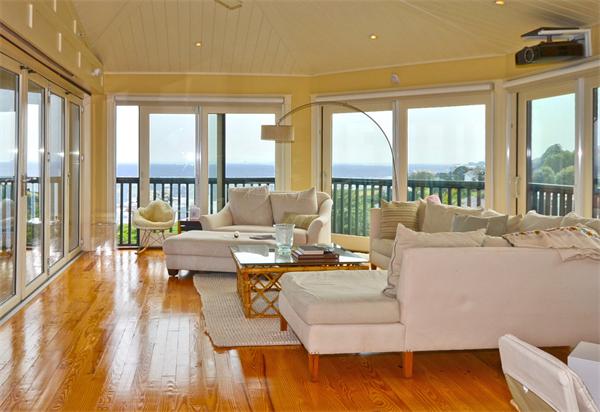 575 Tuckerman Avenue, Unit P Middletown, RI 02842 - Photo 5 of 30 a living room with furniture and a large window