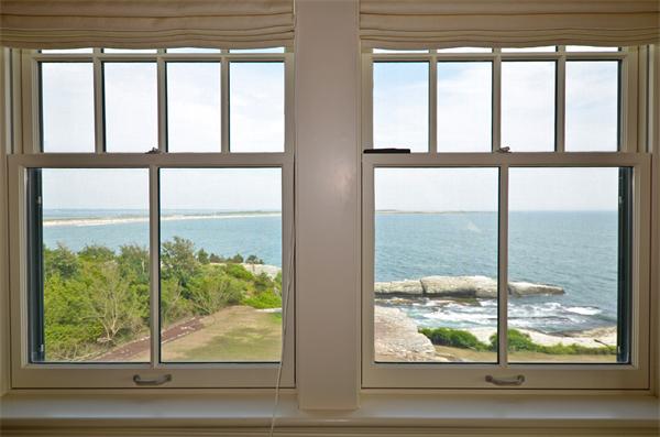 575 Tuckerman Avenue, Unit P Middletown, RI 02842 - Photo 8 of 30 a view of a room with a large window and bed