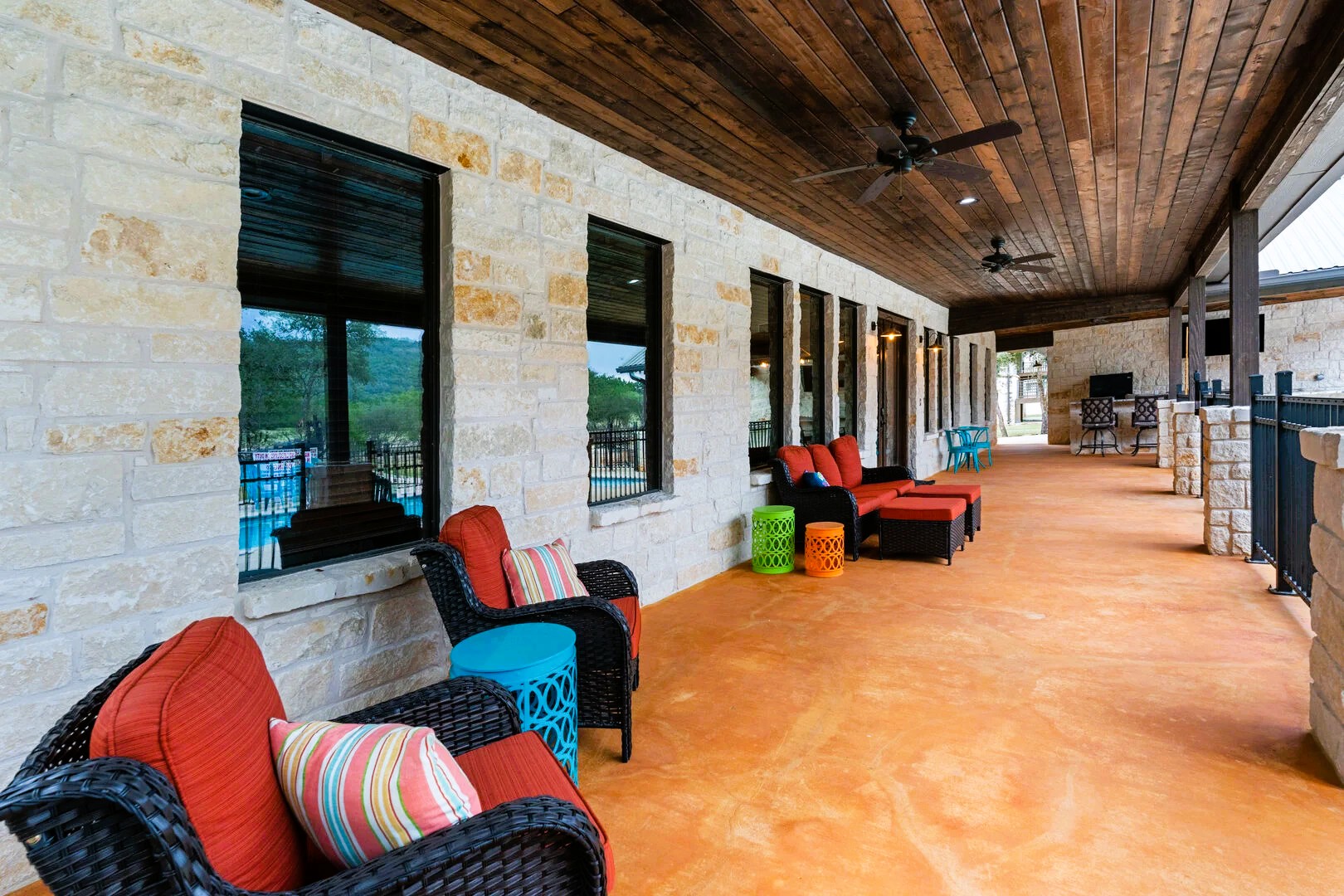 1718 Mountain Valley Road Concan, TX 78838 - Photo 26 of 40 Natural stone walls and a warm stained wood ceiling line this expansive covered terrace.