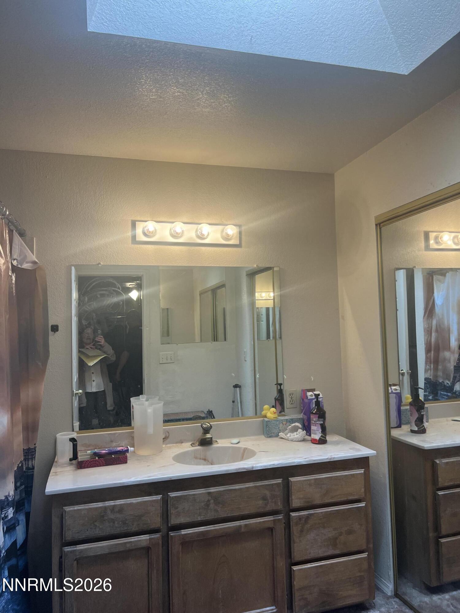 4263 Furgerson Ranch Road Carson City, NV 89701 - Photo 4 of 7 a bathroom with a sink and a mirror