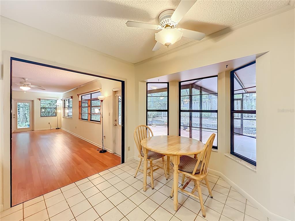1942 Country Club Road Eustis, FL 32726 - Photo 15 of 56 a view of a dining room with furniture and a table