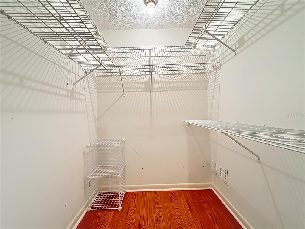 1942 Country Club Road Eustis, FL 32726 - Photo 21 of 56 a view of a room with racks on the wall