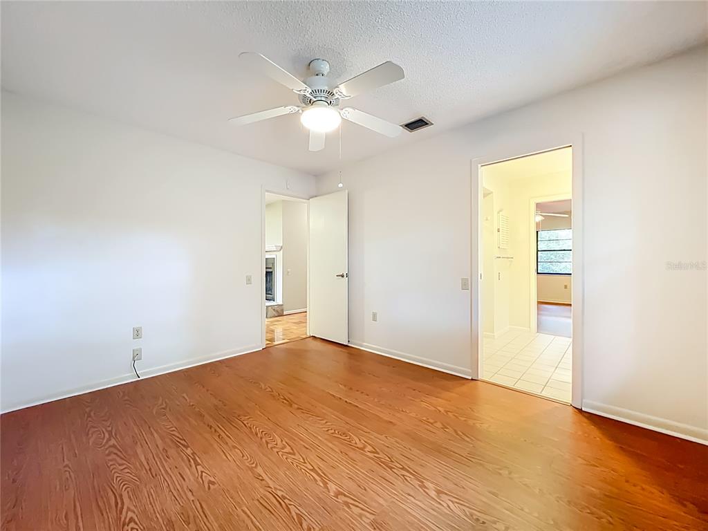 1942 Country Club Road Eustis, FL 32726 - Photo 26 of 56 wooden floor in an empty room