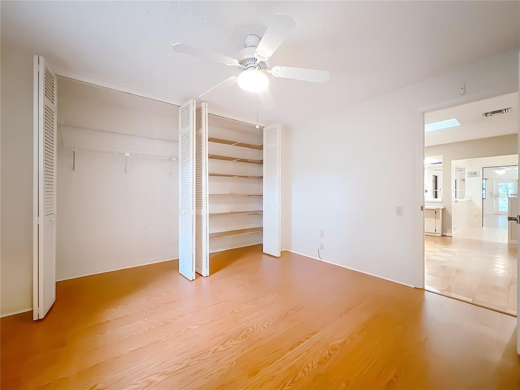 1942 Country Club Road Eustis, FL 32726 - Photo 27 of 56 a view of empty room with wooden floor