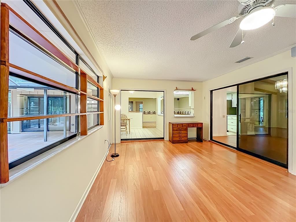1942 Country Club Road Eustis, FL 32726 - Photo 41 of 56 a view of an empty room with glass door and windows