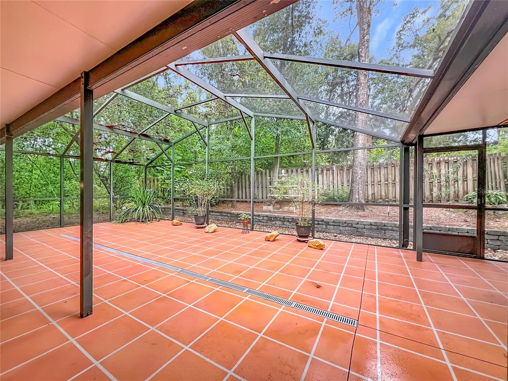 1942 Country Club Road Eustis, FL 32726 - Photo 45 of 56 a view of a swimming pool with a porch