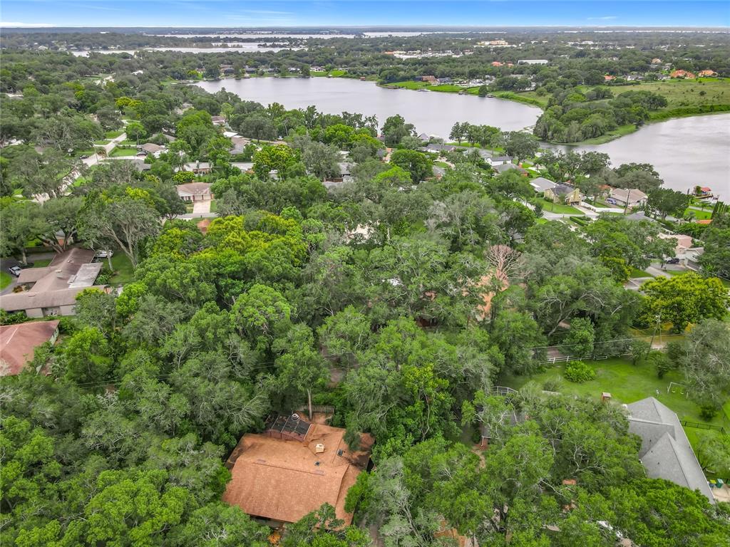 1942 Country Club Road Eustis, FL 32726 - Photo 56 of 56 an aerial view of a houses with a yard
