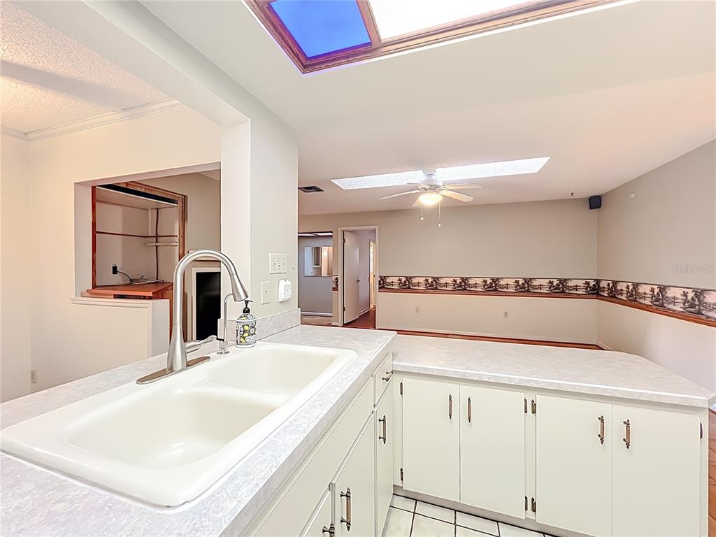 1942 Country Club Road Eustis, FL 32726 - Photo 8 of 56 a bathroom with a sink and a mirror