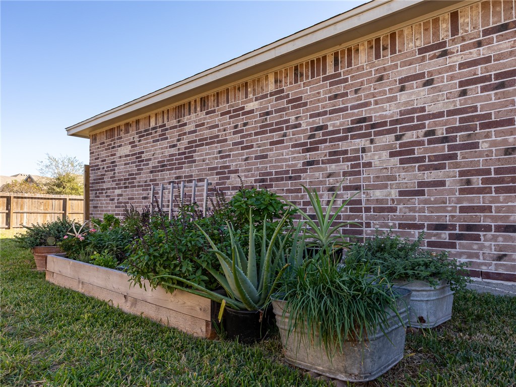 7938 Rancho Vista Boulevard East Corpus Christi, TX 78414 - Photo 35 of 37 Side yard with herb garden