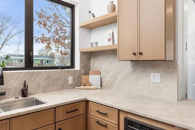 a kitchen with a sink and cabinets