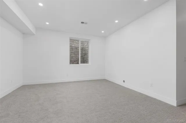 a view of an empty room with stairs