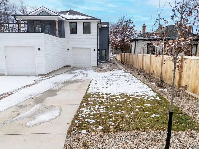 a view of a backyard of the house