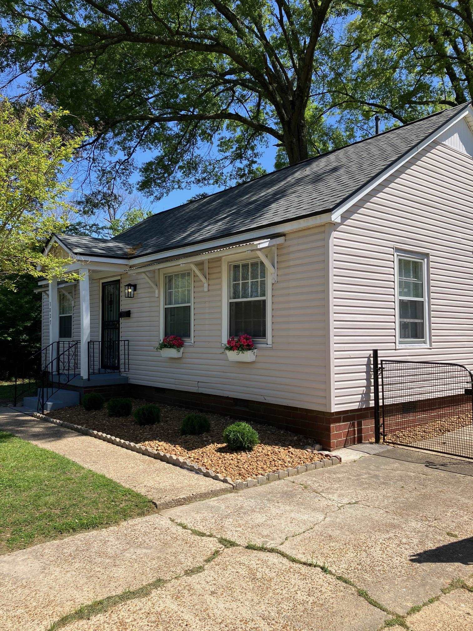 3827 Wilshire Road Memphis, TN 38111 - Photo 2 of 11 Lawn care is provided with rental. Easy care landscape is fully fenced. Some large trees in backyard.