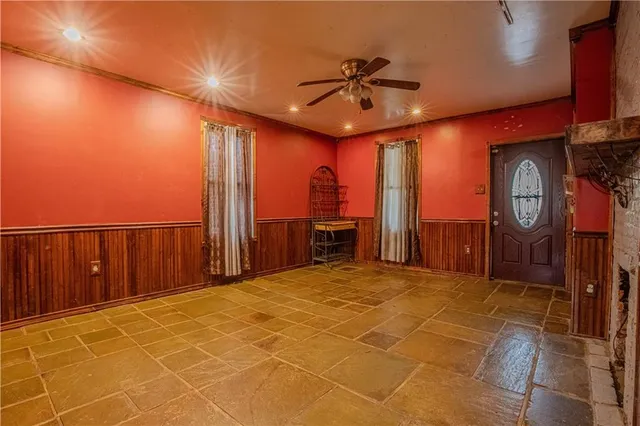 a couple of table and chairs in front of door