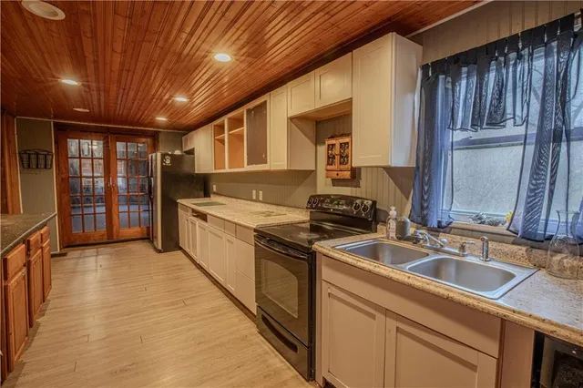 a kitchen with sink and cabinets