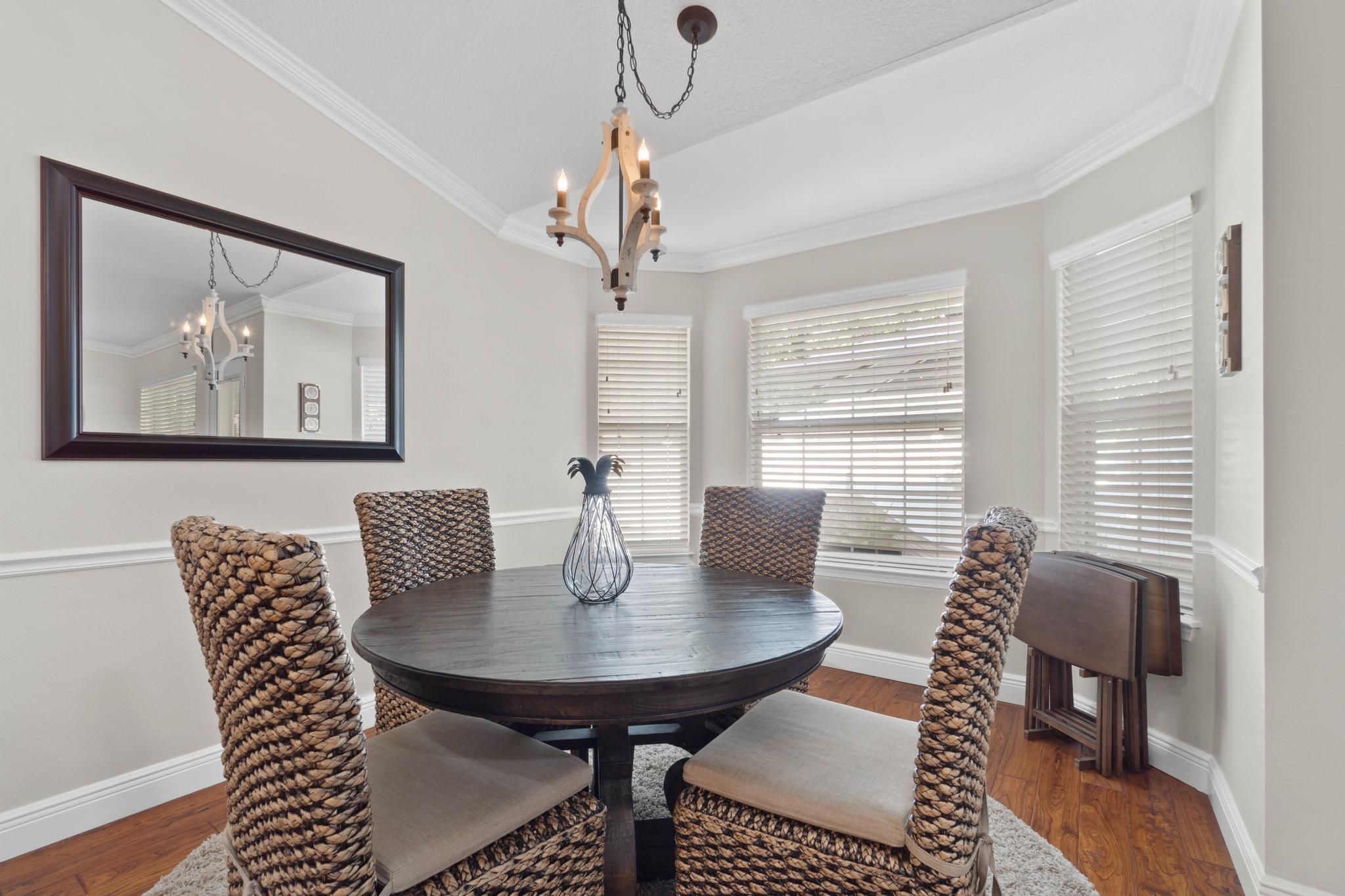 99 Inlet Drive Santa Rosa Beach, FL 32459 - Photo 12 of 52 a view of a dining room with furniture window and wooden floor