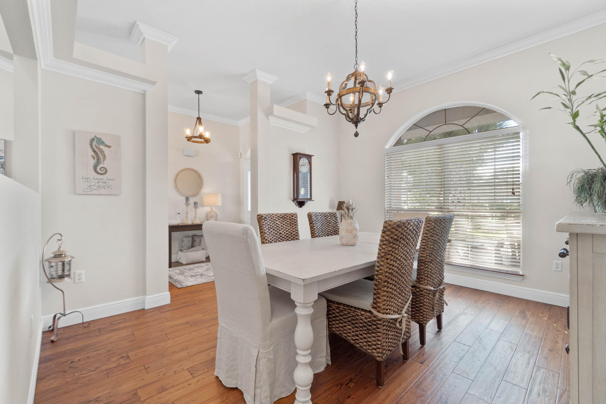 99 Inlet Drive Santa Rosa Beach, FL 32459 - Photo 17 of 52 a view of a dining room with furniture window and wooden floor