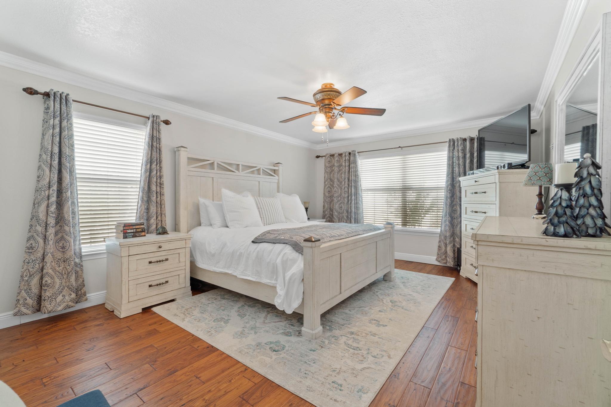 99 Inlet Drive Santa Rosa Beach, FL 32459 - Photo 19 of 52 a bed room with a bed and a chandelier