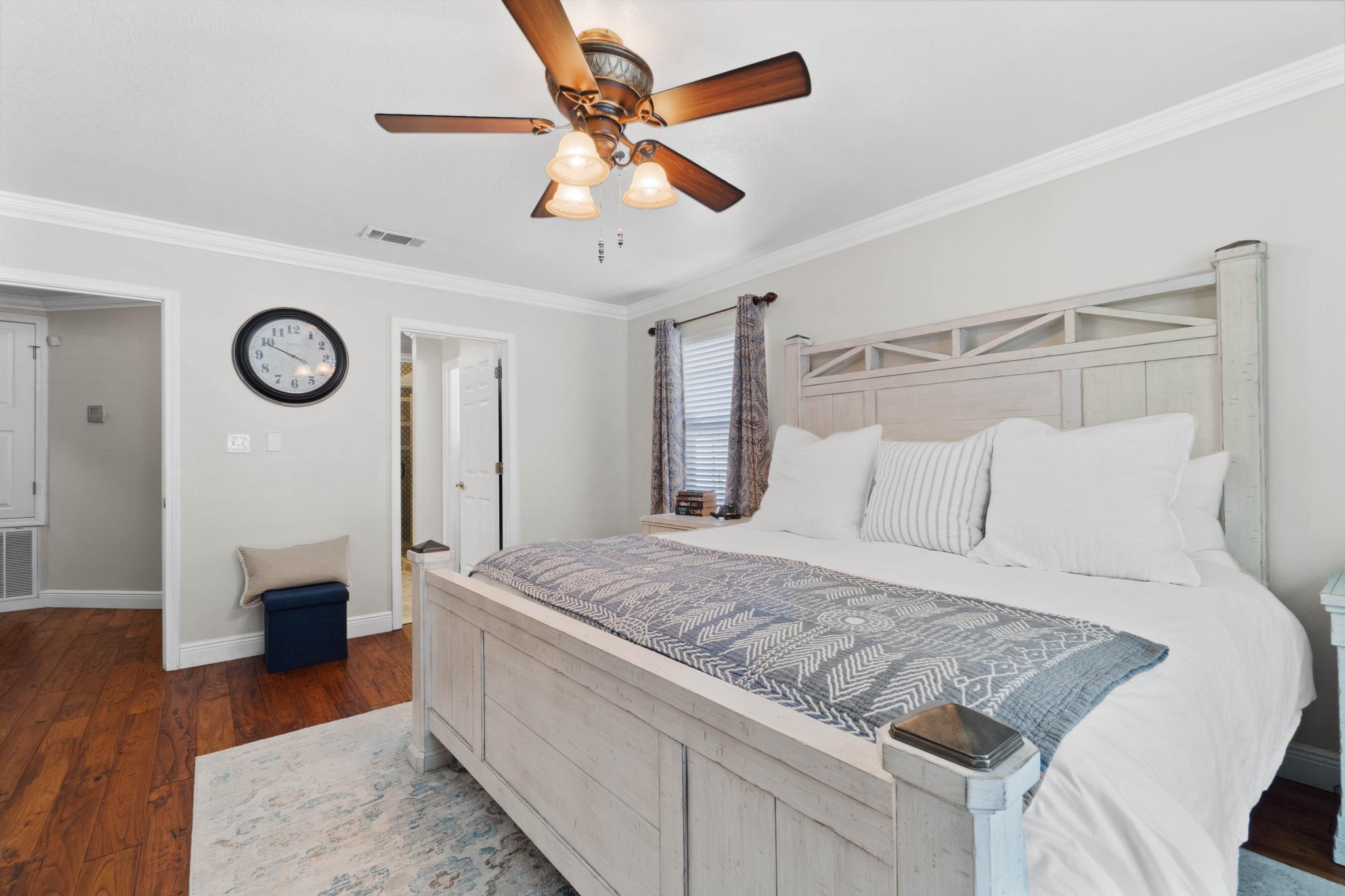 99 Inlet Drive Santa Rosa Beach, FL 32459 - Photo 20 of 52 a bedroom with a bed and a chandelier