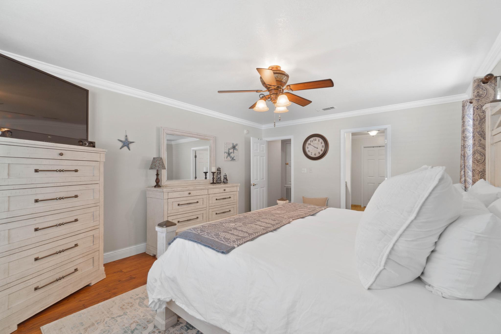 99 Inlet Drive Santa Rosa Beach, FL 32459 - Photo 21 of 52 a bedroom with a bed and a flat screen tv