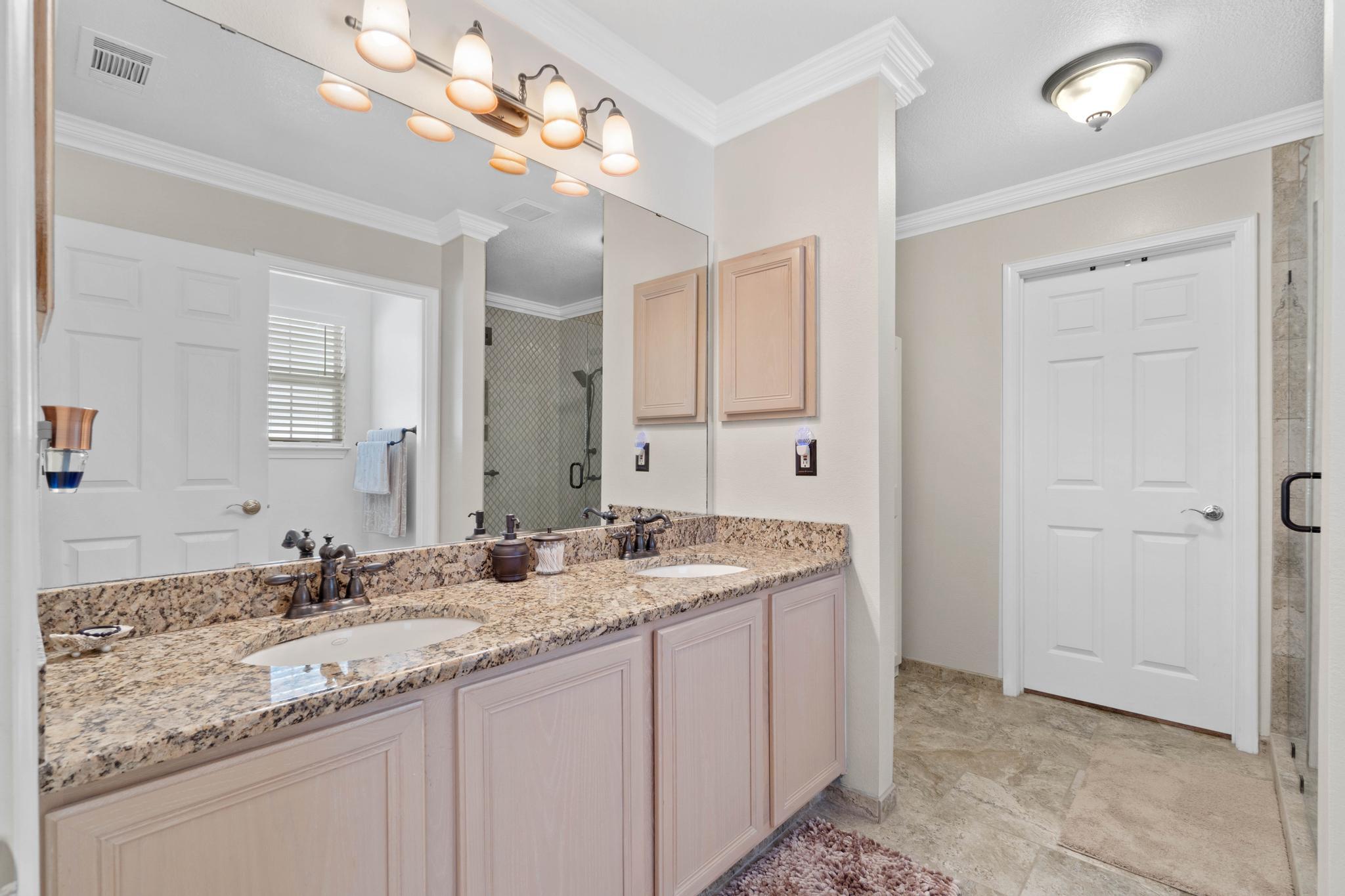 99 Inlet Drive Santa Rosa Beach, FL 32459 - Photo 22 of 52 a bathroom with a sink double vanity and a mirror