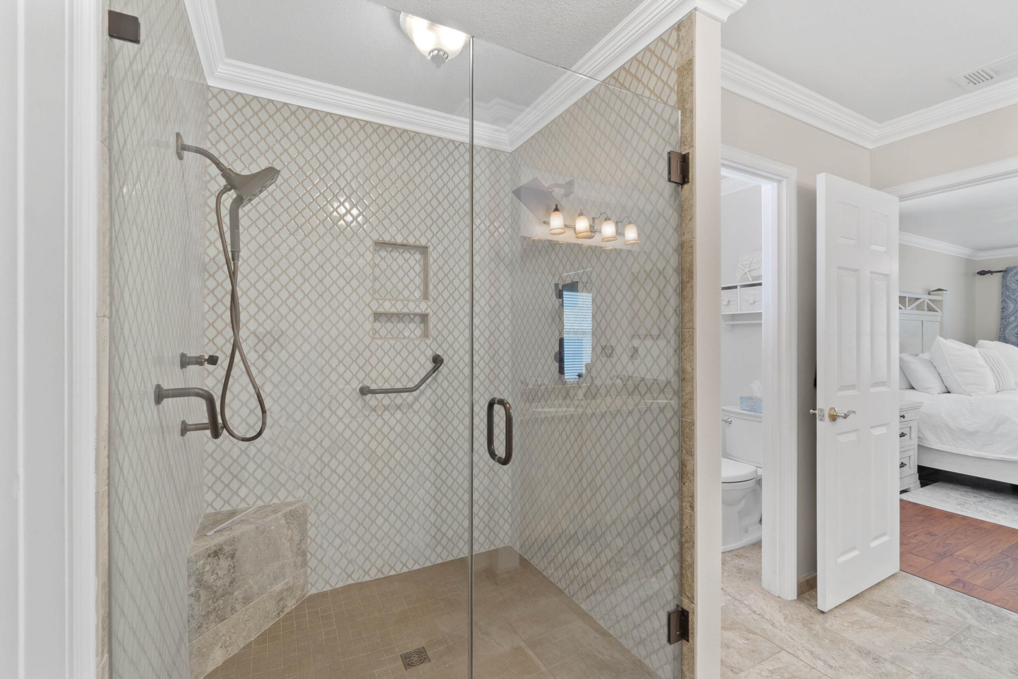 99 Inlet Drive Santa Rosa Beach, FL 32459 - Photo 24 of 52 a bathroom with a glass shower door