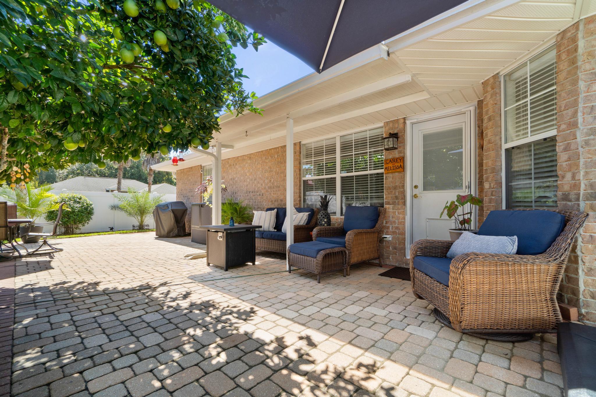 99 Inlet Drive Santa Rosa Beach, FL 32459 - Photo 45 of 52 a view of a patio with couches and potted plants