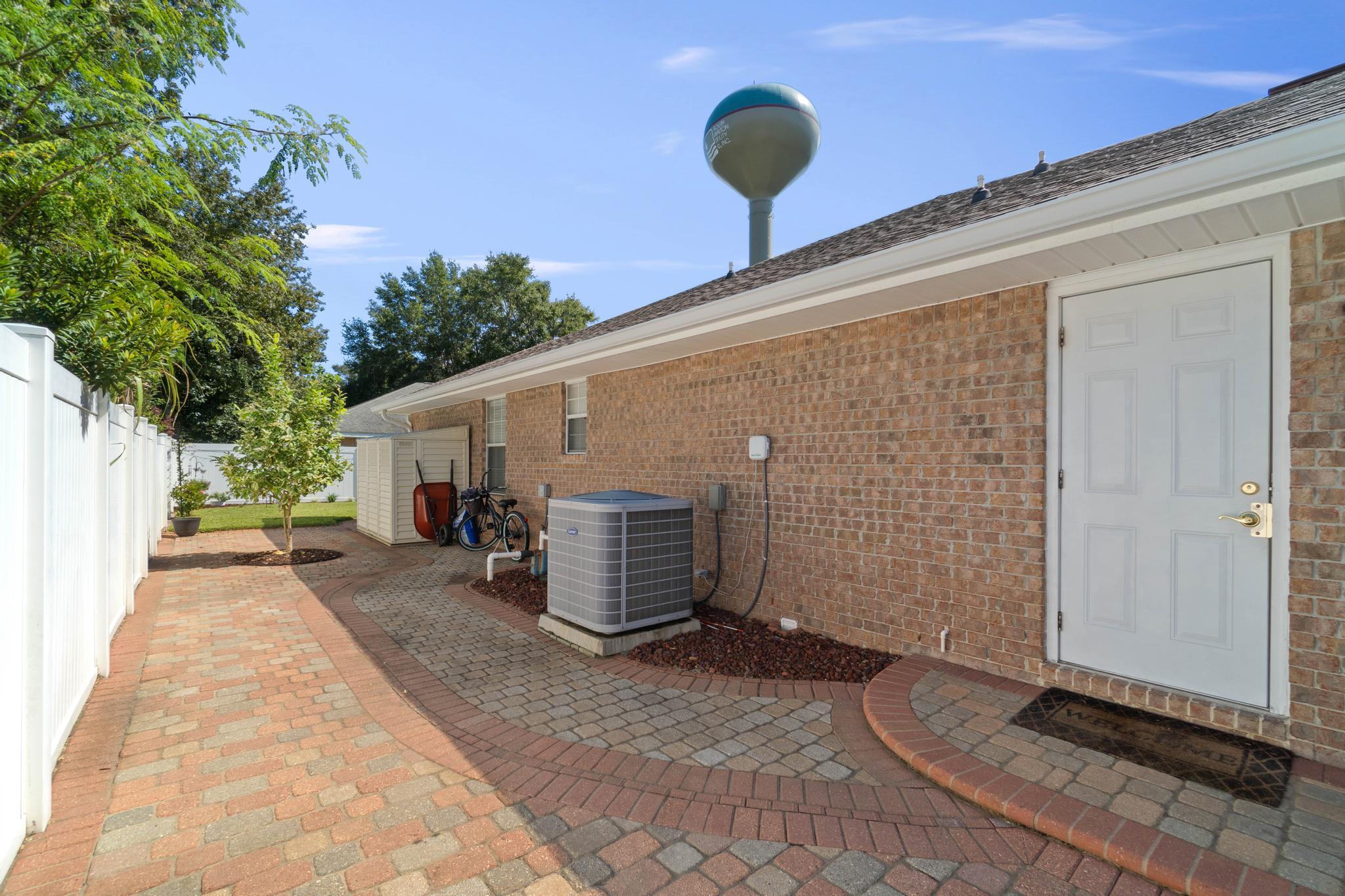 99 Inlet Drive Santa Rosa Beach, FL 32459 - Photo 50 of 52 a backyard of a house with potted plants