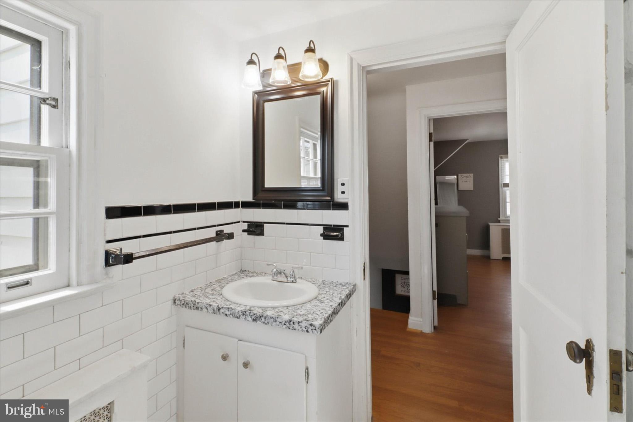 523 Pleasure Road Lancaster, PA 17601 - Photo 16 of 24 a bathroom with a sink and a mirror