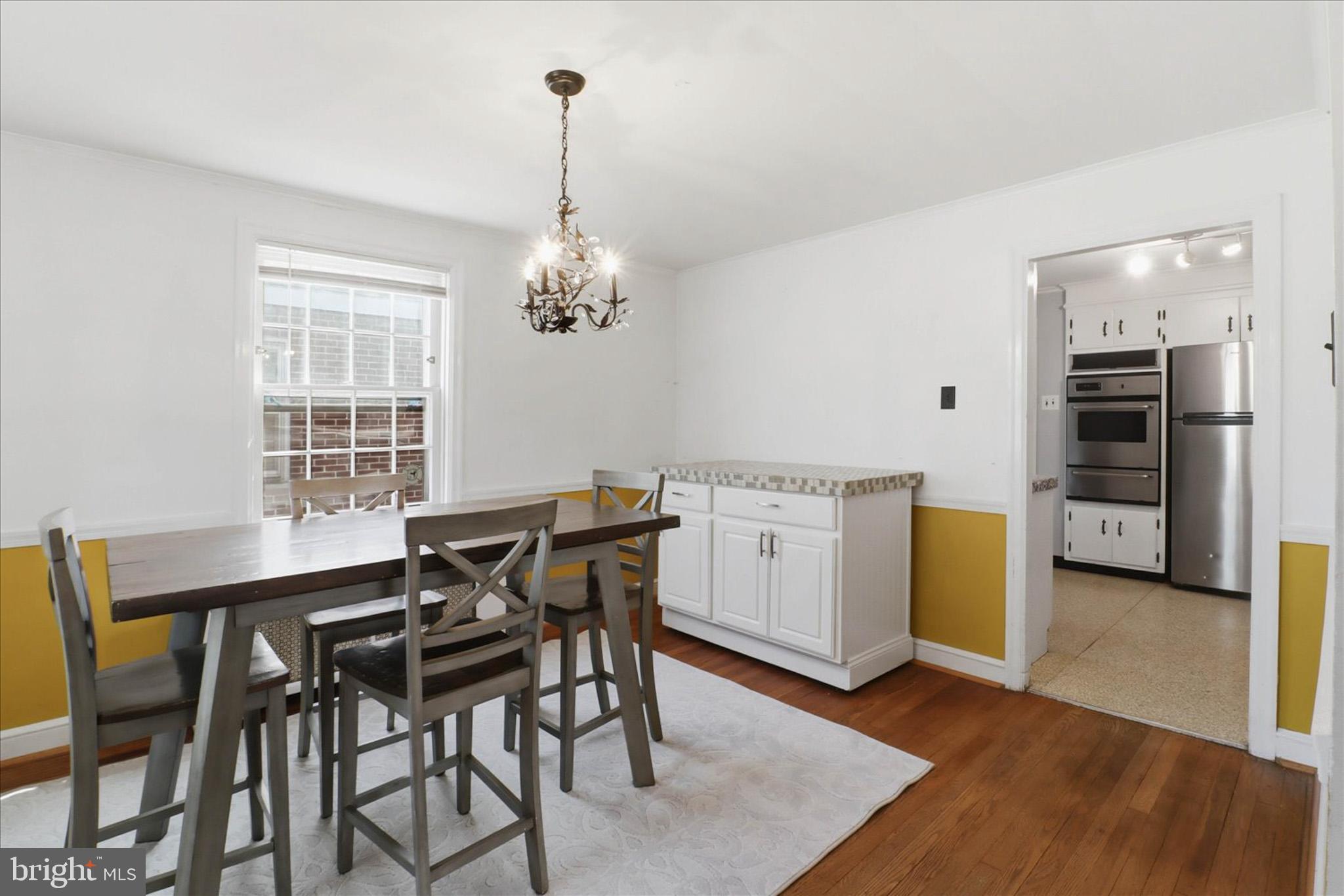 523 Pleasure Road Lancaster, PA 17601 - Photo 8 of 24 a view of a dining room with furniture and wooden floor